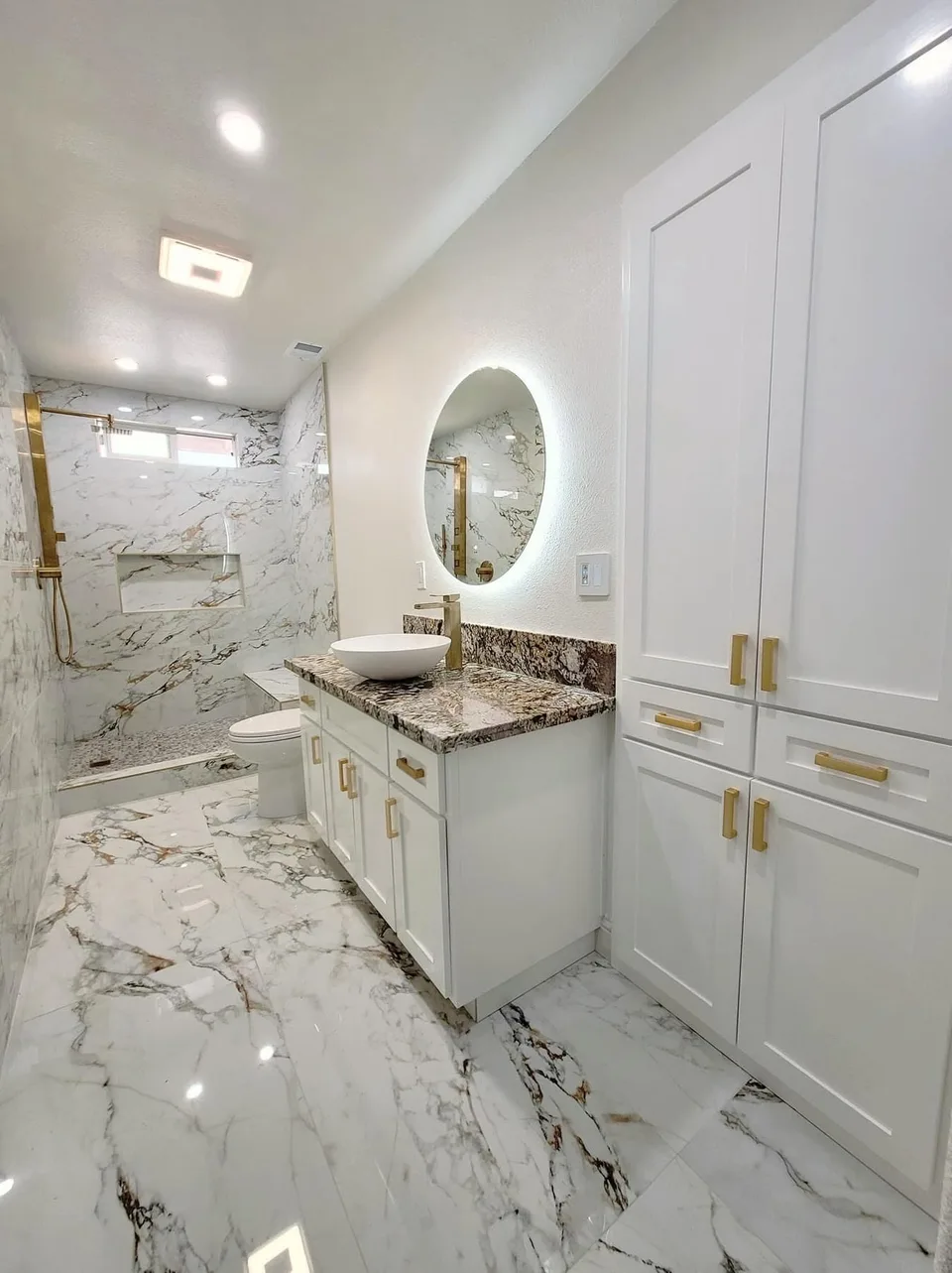 Custom bathroom vanity and tiled shower